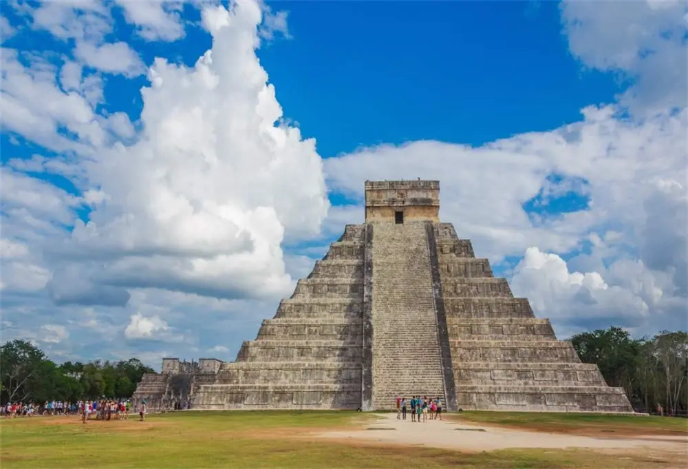Seasonal activities in Cancun with tourists exploring Mayan ruins