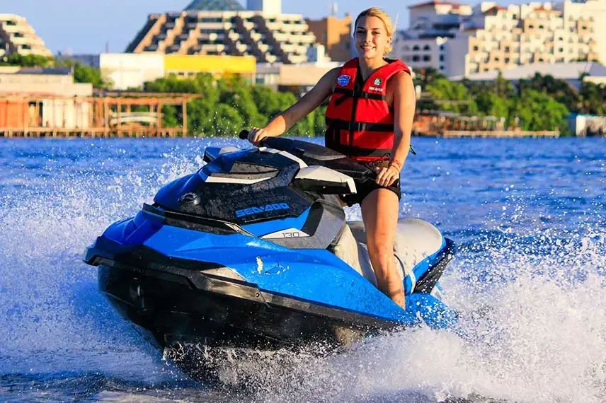 A beautiful girl riding a jetski in cancun